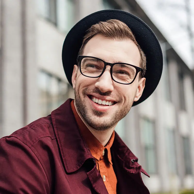 handsome-cheerful-man-in-eyeglasses-and-hat-2022-01-18-23-57-55-utc